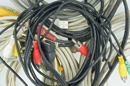 Old and dirty several type of cable for computer on white background.