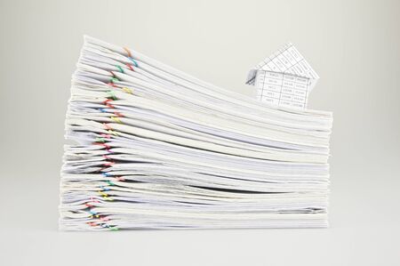 House on stack old paper report of sales and receipt.