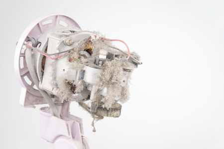 Close up dust on motor of electric fan with white background and copy space. Maintenance and healthy concept photography.の写真素材