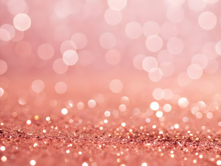 A beautiful rose gold glitter background with sparkling lights and a bokeh effect. Perfect for adding a touch of glamour and elegance to any design or project.の素材