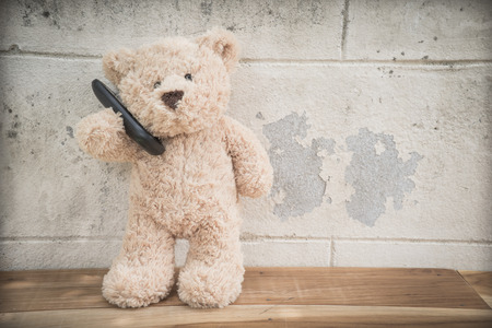 teddybear talking on mobile phoneの写真素材