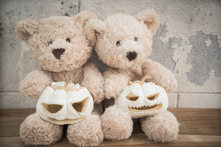 teddybears with carved pumpkins ready for Halloweenの写真素材