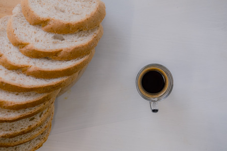 fresh bread and baked goods on wooden chopping board, rustic styleの写真素材
