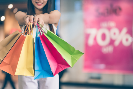 Happy beautiful young asian woman doing shoppingの写真素材