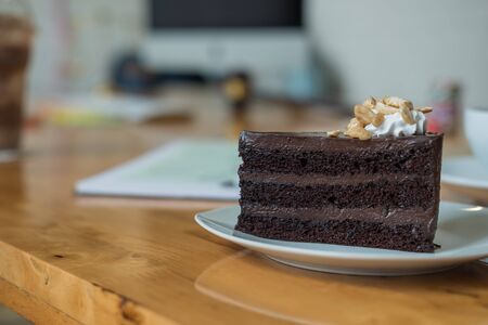 A piece of chocolate cake on the table, close-upの写真素材
