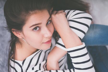 Beautiful young girl smiling, looking happy and carefreeの写真素材