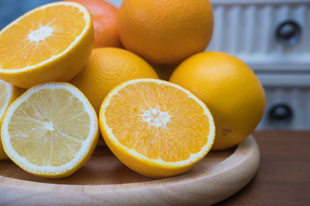 Orange with half of orange isolated on the white backgroundの写真素材