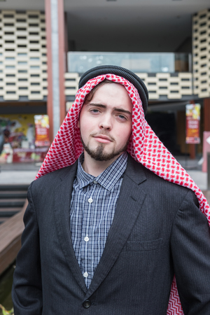 Arab business man standing and working at his market, business conceptの写真素材