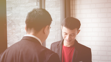Businessmen meeting to discuss and consult on the future plans of their work togetherの写真素材