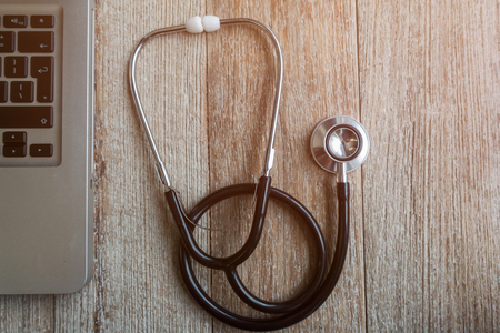 Stethoscope with computer and phone - computer system maintenance and check conの写真素材