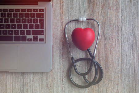 Stethoscope with computer and phone - computer system maintenance and check conの写真素材
