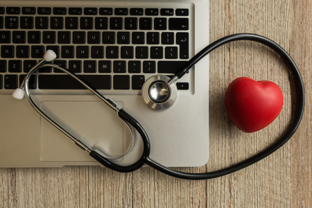 Stethoscope with computer and phone - computer system maintenance and check conの写真素材