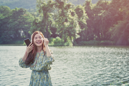 beautiful young asian girl have a happy time alone , vintage toneの写真素材