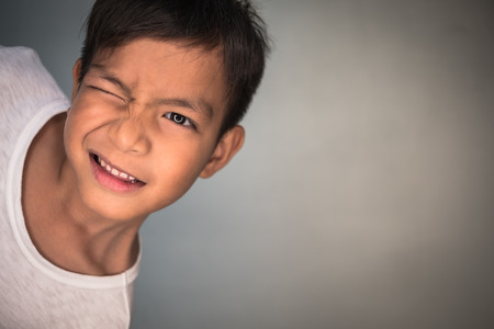 Close up face portrait little young asian boy