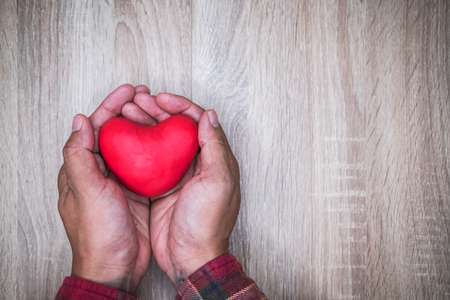 hand holding a red heart, valentine's day love, vintage tone の写真素材
