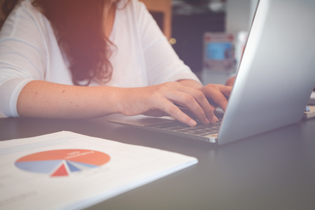 Calculating the cost of postage of a small package, Small business enterprise concernsの写真素材