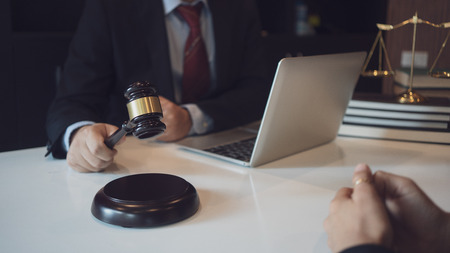 Client and lawyer have a sit down face to face meeting to discuss the legal options availableの写真素材