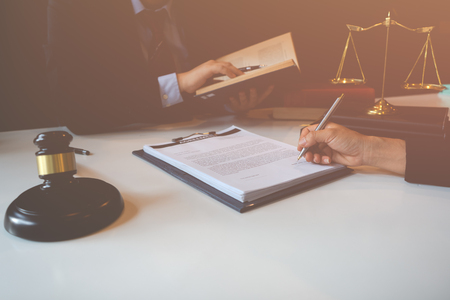 Client and lawyer have a sit down face to face meeting to discuss the legal options availableの写真素材