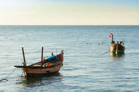 Small wooden fishing boat in Thailandの写真素材