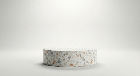 A stylish cylindrical podium made of multi-colored terrazzo, standing out against a clean, brilliant white background with soft, even studio lighting.の素材