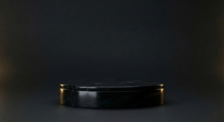 A sleek black marble cylindrical podium centered against a dark, subtle background, exuding a sense of luxury and refinement for product showcases and presentations.の素材