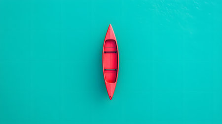 A solitary, bright red canoe drifts serenely on a vast expanse of clear, turquoise water. The minimalist composition from a high aerial perspective emphasizes isolation, adventure, and the beauty of nature's tranquility.の素材