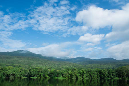 Chiangmai Hill and lake landscape with cloudy blue skyの写真素材