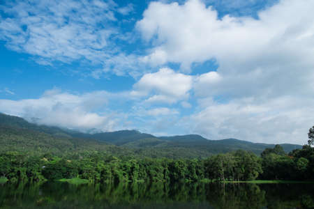 Chiangmai Hill and lake landscape with cloudy blue skyの写真素材