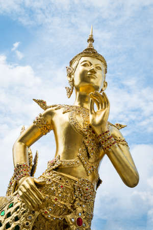 Golden Statue in Thai Temple, Wat phra kaeo, Bangkok, Thailandの写真素材