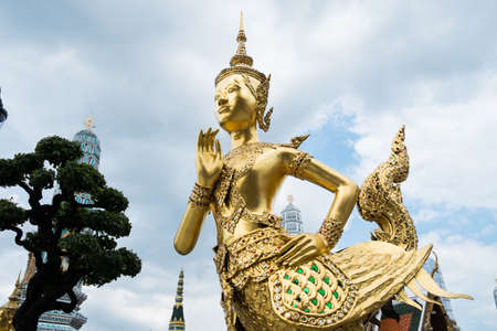 Golden Statue in Thai temple, Wat phra kaeo, Bangkok, Thailandの写真素材