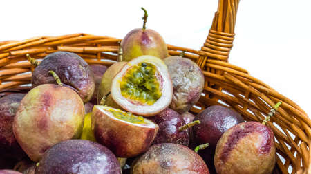 Passion fruit in a basket on a white background