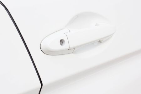 Car door handle of white modern carの写真素材