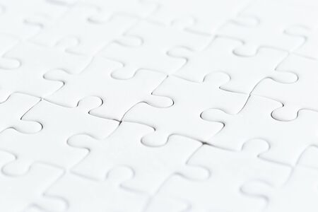 close up white jigsaw game puzzle.