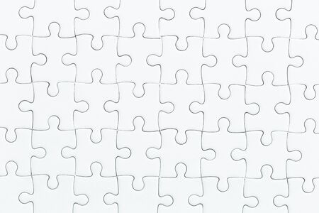 close up white jigsaw game puzzle. texture background.の写真素材