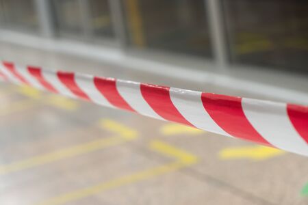 White and red barrier tape for partition danger zone.の写真素材