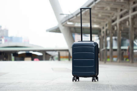 Single luggage on floor in city.の写真素材