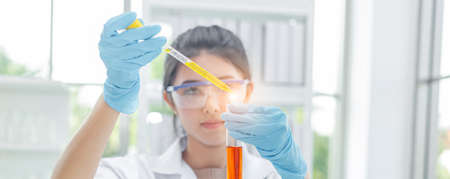 cropping image, young asian women scientist research and test in laboratory.