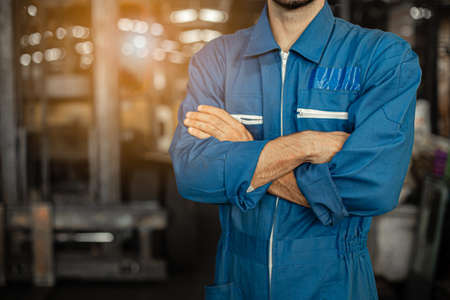 Close up image Engineer men wearing uniform safety in factory background.の写真素材