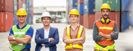 Teamwork engineer technician and foreman and partner wearing safety helmet in cargo container...