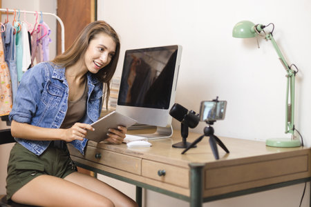 Young woman working online artist youtuber broadcasting live.の写真素材