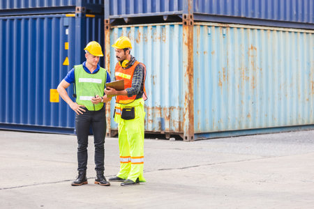 foreman and engineer logistic containers export and import in cargo ship, Industrial container cargo...