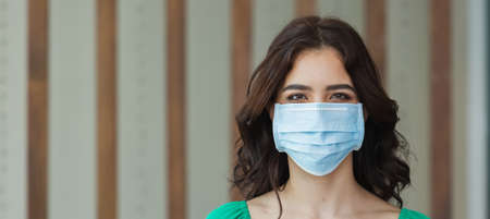 close up face woman wearing medical mask for prevent dust and infection virus, crop image banner size.の写真素材