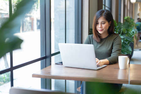 women working with laptop in cefe, coworking spaces, work at home.の写真素材