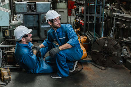 Engineer men wearing uniform accident on floor from work and saviour. health and safety concept.の写真素材