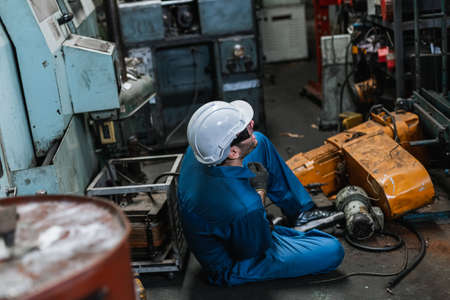 Engineer men wearing uniform accident on floor from work. health and safety concept.の写真素材