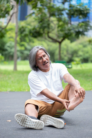 Elderly man accident from exercise. foot painの写真素材