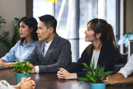 asian business people sitting listen and present reviews in meeting room, leadership present, business teamwork partner concept.の写真素材