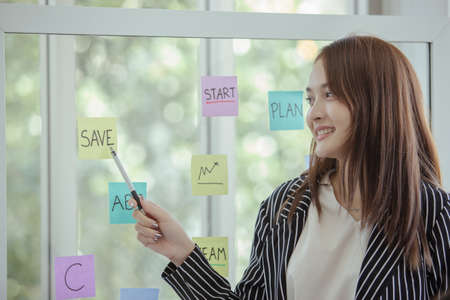 young woman finger to text save. work presentation about the use of money.