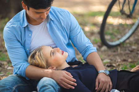 Happy couple romantic moments dating in garden, couple conceptの写真素材