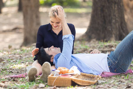 Happy couple romantic moments dating in garden, couple conceptの写真素材